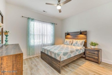 Coastal charm and a fantastic location come together in this on Oak Island Golf Club in North Carolina - for sale on GolfHomes.com, golf home, golf lot