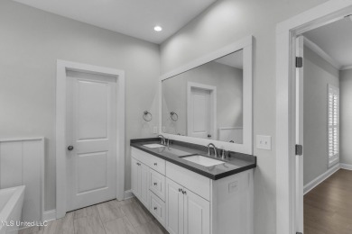 Do not miss this Beautiful white brick home with wonderful on Lake Caroline Golf Club in Mississippi - for sale on GolfHomes.com, golf home, golf lot