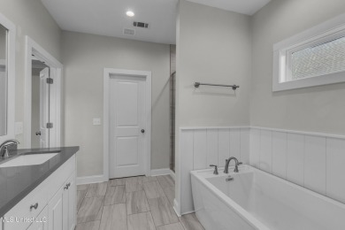 Do not miss this Beautiful white brick home with wonderful on Lake Caroline Golf Club in Mississippi - for sale on GolfHomes.com, golf home, golf lot