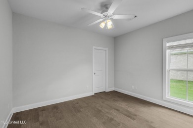 Do not miss this Beautiful white brick home with wonderful on Lake Caroline Golf Club in Mississippi - for sale on GolfHomes.com, golf home, golf lot