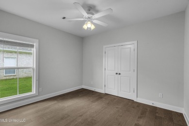 Do not miss this Beautiful white brick home with wonderful on Lake Caroline Golf Club in Mississippi - for sale on GolfHomes.com, golf home, golf lot