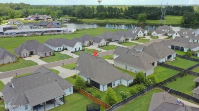 Do not miss this Beautiful white brick home with wonderful on Lake Caroline Golf Club in Mississippi - for sale on GolfHomes.com, golf home, golf lot