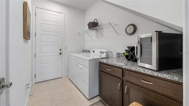 Discover exclusive living in this luxury townhome nestled within on Eagle Creek Golf Club in Florida - for sale on GolfHomes.com, golf home, golf lot