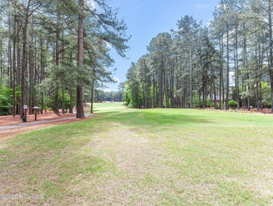Overlooking the 7th green of Pinewild's Magnolia Course, this on Pinewild Country Club of Pinehurst in North Carolina - for sale on GolfHomes.com, golf home, golf lot