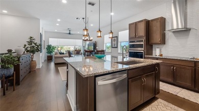 Discover exclusive living in this luxury townhome nestled within on Eagle Creek Golf Club in Florida - for sale on GolfHomes.com, golf home, golf lot