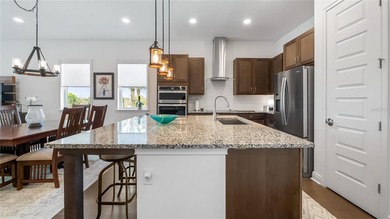 Discover exclusive living in this luxury townhome nestled within on Eagle Creek Golf Club in Florida - for sale on GolfHomes.com, golf home, golf lot