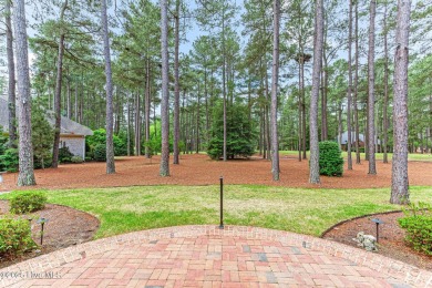 Overlooking the 7th green of Pinewild's Magnolia Course, this on Pinewild Country Club of Pinehurst in North Carolina - for sale on GolfHomes.com, golf home, golf lot