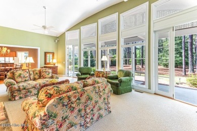 Overlooking the 7th green of Pinewild's Magnolia Course, this on Pinewild Country Club of Pinehurst in North Carolina - for sale on GolfHomes.com, golf home, golf lot