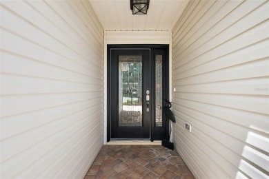 MAGNIFICENT 3/2 Whispering Pine with STUNNING HEATED POOL and on The Links of Spruce Creek in Florida - for sale on GolfHomes.com, golf home, golf lot