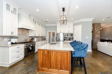 Welcome Home! Situated on a corner lot in the Prestigious Carter on Carter Plantation Golf Course in Louisiana - for sale on GolfHomes.com, golf home, golf lot