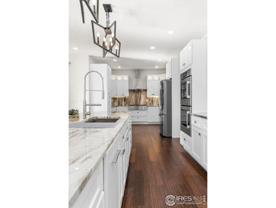 At the end of a quiet cul-de-sac in Windsor's prestigious Water on Pelican Lakes Golf and Country Club in Colorado - for sale on GolfHomes.com, golf home, golf lot