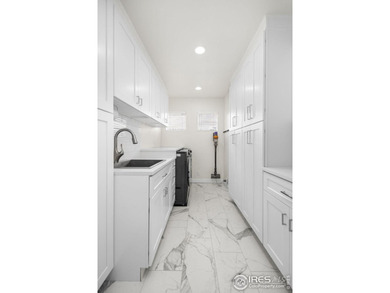 At the end of a quiet cul-de-sac in Windsor's prestigious Water on Pelican Lakes Golf and Country Club in Colorado - for sale on GolfHomes.com, golf home, golf lot