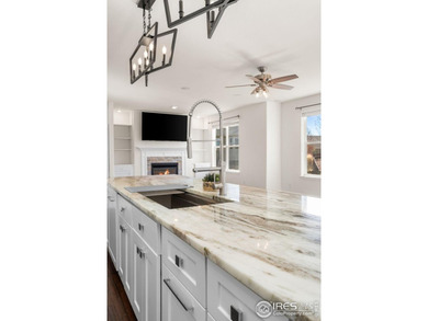 At the end of a quiet cul-de-sac in Windsor's prestigious Water on Pelican Lakes Golf and Country Club in Colorado - for sale on GolfHomes.com, golf home, golf lot