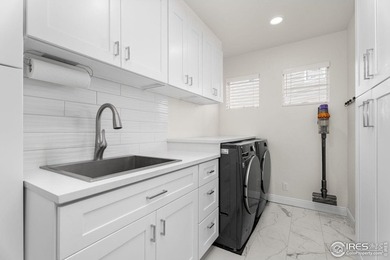 At the end of a quiet cul-de-sac in Windsor's prestigious Water on Pelican Lakes Golf and Country Club in Colorado - for sale on GolfHomes.com, golf home, golf lot