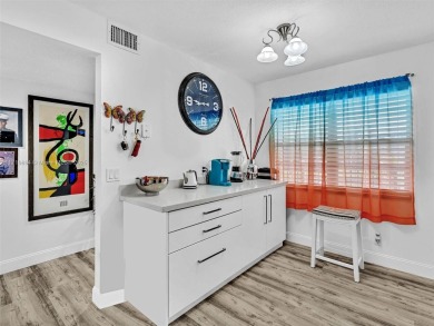 This beautifully remodeled 2/2 second floor unit has a gorgeous on Flamingo Lakes Country Club in Florida - for sale on GolfHomes.com, golf home, golf lot