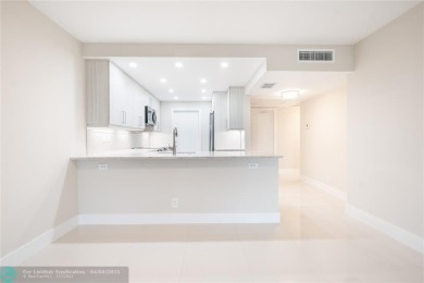 NOTHING HAS BEEN SPARED IN THIS BEAUTIFULLY FULLY RENOVATED AND on Palm-Aire Country Club and Resort - Palms in Florida - for sale on GolfHomes.com, golf home, golf lot
