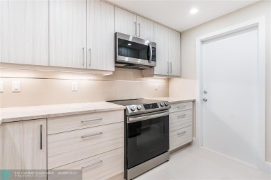 NOTHING HAS BEEN SPARED IN THIS BEAUTIFULLY FULLY RENOVATED AND on Palm-Aire Country Club and Resort - Palms in Florida - for sale on GolfHomes.com, golf home, golf lot