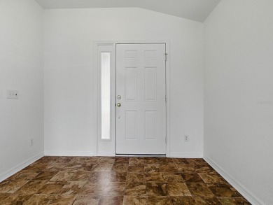 One or more photo(s) has been virtually staged. GREAT PRICE on on Eagle Ridge At Spruce Creek Country Club in Florida - for sale on GolfHomes.com, golf home, golf lot