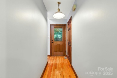 Nestled on a peaceful hilltop, this spacious 3-bedroom on Black Mountain Golf Course in North Carolina - for sale on GolfHomes.com, golf home, golf lot