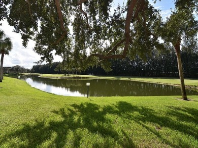 Enjoy beautiful LAKE and GOLF COURSE VIEWS from this desirable on Vista Plantation Golf Club in Florida - for sale on GolfHomes.com, golf home, golf lot