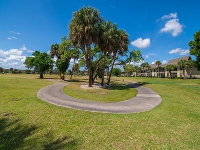 Enjoy beautiful LAKE and GOLF COURSE VIEWS from this desirable on Vista Plantation Golf Club in Florida - for sale on GolfHomes.com, golf home, golf lot