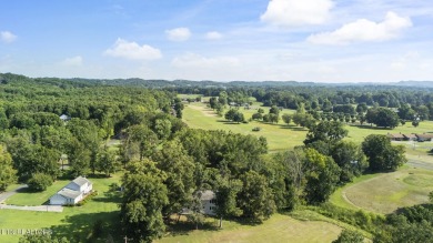Set on a lush, green lot in the heart of Baneberry, this warm on Baneberry Golf and Resort Club in Tennessee - for sale on GolfHomes.com, golf home, golf lot