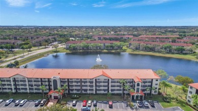 Spacious Magnolia corner unit with a lake view at Century on Flamingo Lakes Country Club in Florida - for sale on GolfHomes.com, golf home, golf lot