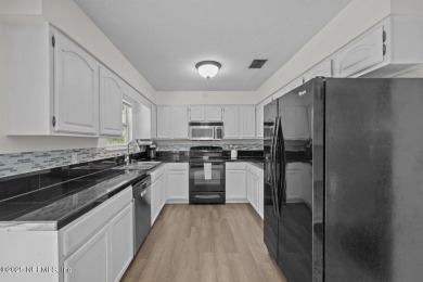 Affordable turn key home situated on nice lot w/circular on Palatka Golf Club in Florida - for sale on GolfHomes.com, golf home, golf lot