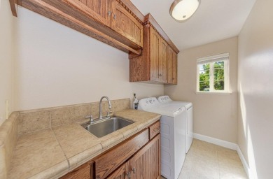 Located on a corner lot overlooking the 8th fairway of the on Yosemite Lakes Park Golf Course in California - for sale on GolfHomes.com, golf home, golf lot