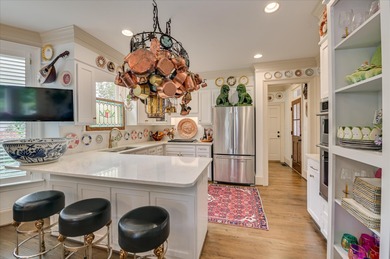 Stately and beautifully remodeled 4-bedroom, 3.5-bath brick home on West Lake Country Club in Georgia - for sale on GolfHomes.com, golf home, golf lot