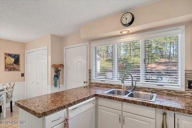 Don't miss this golf front condo with golf and WATER views on a on Whispering Woods in North Carolina - for sale on GolfHomes.com, golf home, golf lot