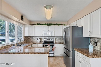 Don't miss this golf front condo with golf and WATER views on a on Whispering Woods in North Carolina - for sale on GolfHomes.com, golf home, golf lot