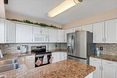 Don't miss this golf front condo with golf and WATER views on a on Whispering Woods in North Carolina - for sale on GolfHomes.com, golf home, golf lot