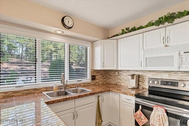 Don't miss this golf front condo with golf and WATER views on a on Whispering Woods in North Carolina - for sale on GolfHomes.com, golf home, golf lot