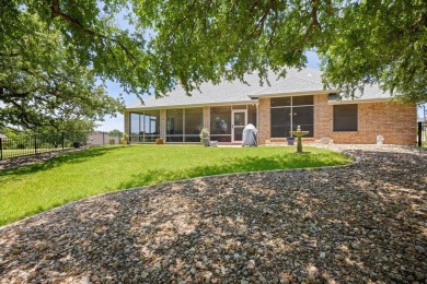 Gorgeous - fantastic drive up appeal and outstanding fairway on Pecan Plantation Country Club in Texas - for sale on GolfHomes.com, golf home, golf lot