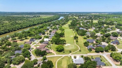 Gorgeous - fantastic drive up appeal and outstanding fairway on Pecan Plantation Country Club in Texas - for sale on GolfHomes.com, golf home, golf lot