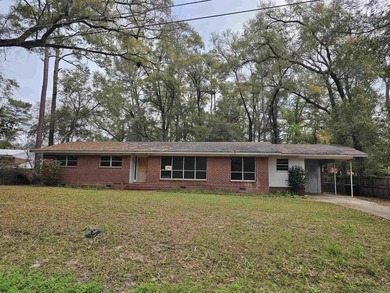 Roomy and filled with opportunity, this 4-bedroom, 2-bath home on Jake Gaither Golf Course in Florida - for sale on GolfHomes.com, golf home, golf lot