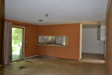 Roomy and filled with opportunity, this 4-bedroom, 2-bath home on Jake Gaither Golf Course in Florida - for sale on GolfHomes.com, golf home, golf lot