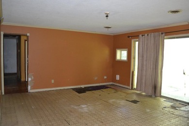 Roomy and filled with opportunity, this 4-bedroom, 2-bath home on Jake Gaither Golf Course in Florida - for sale on GolfHomes.com, golf home, golf lot