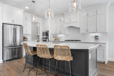 Built in 2021, this stunning 5-bedroom, 4.5-bath white brick on Lantana Golf Club in Texas - for sale on GolfHomes.com, golf home, golf lot