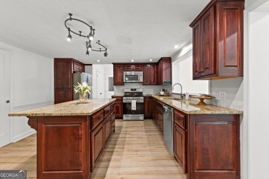 Discover this beautifully maintained brick 4-bedroom, 2.5-bath on Canongate At Flat Creek Club in Georgia - for sale on GolfHomes.com, golf home, golf lot
