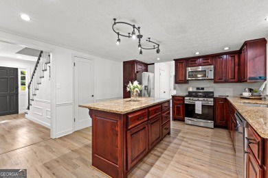 Discover this beautifully maintained brick 4-bedroom, 2.5-bath on Canongate At Flat Creek Club in Georgia - for sale on GolfHomes.com, golf home, golf lot