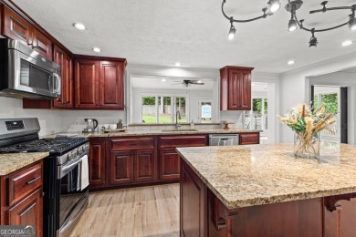 Discover this beautifully maintained brick 4-bedroom, 2.5-bath on Canongate At Flat Creek Club in Georgia - for sale on GolfHomes.com, golf home, golf lot