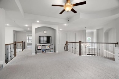 Built in 2021, this stunning 5-bedroom, 4.5-bath white brick on Lantana Golf Club in Texas - for sale on GolfHomes.com, golf home, golf lot