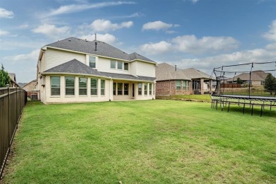 Built in 2021, this stunning 5-bedroom, 4.5-bath white brick on Lantana Golf Club in Texas - for sale on GolfHomes.com, golf home, golf lot