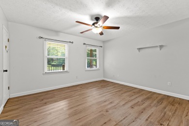 Discover this beautifully maintained brick 4-bedroom, 2.5-bath on Canongate At Flat Creek Club in Georgia - for sale on GolfHomes.com, golf home, golf lot