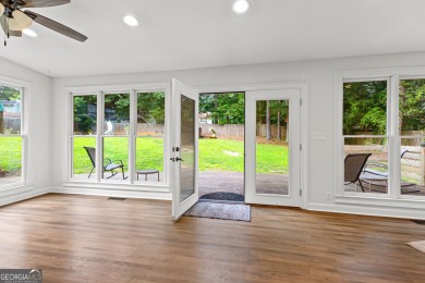 Discover this beautifully maintained brick 4-bedroom, 2.5-bath on Canongate At Flat Creek Club in Georgia - for sale on GolfHomes.com, golf home, golf lot