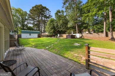 Discover this beautifully maintained brick 4-bedroom, 2.5-bath on Canongate At Flat Creek Club in Georgia - for sale on GolfHomes.com, golf home, golf lot