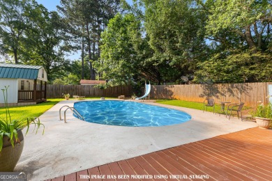 Discover this beautifully maintained brick 4-bedroom, 2.5-bath on Canongate At Flat Creek Club in Georgia - for sale on GolfHomes.com, golf home, golf lot