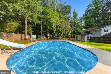 Discover this beautifully maintained brick 4-bedroom, 2.5-bath on Canongate At Flat Creek Club in Georgia - for sale on GolfHomes.com, golf home, golf lot